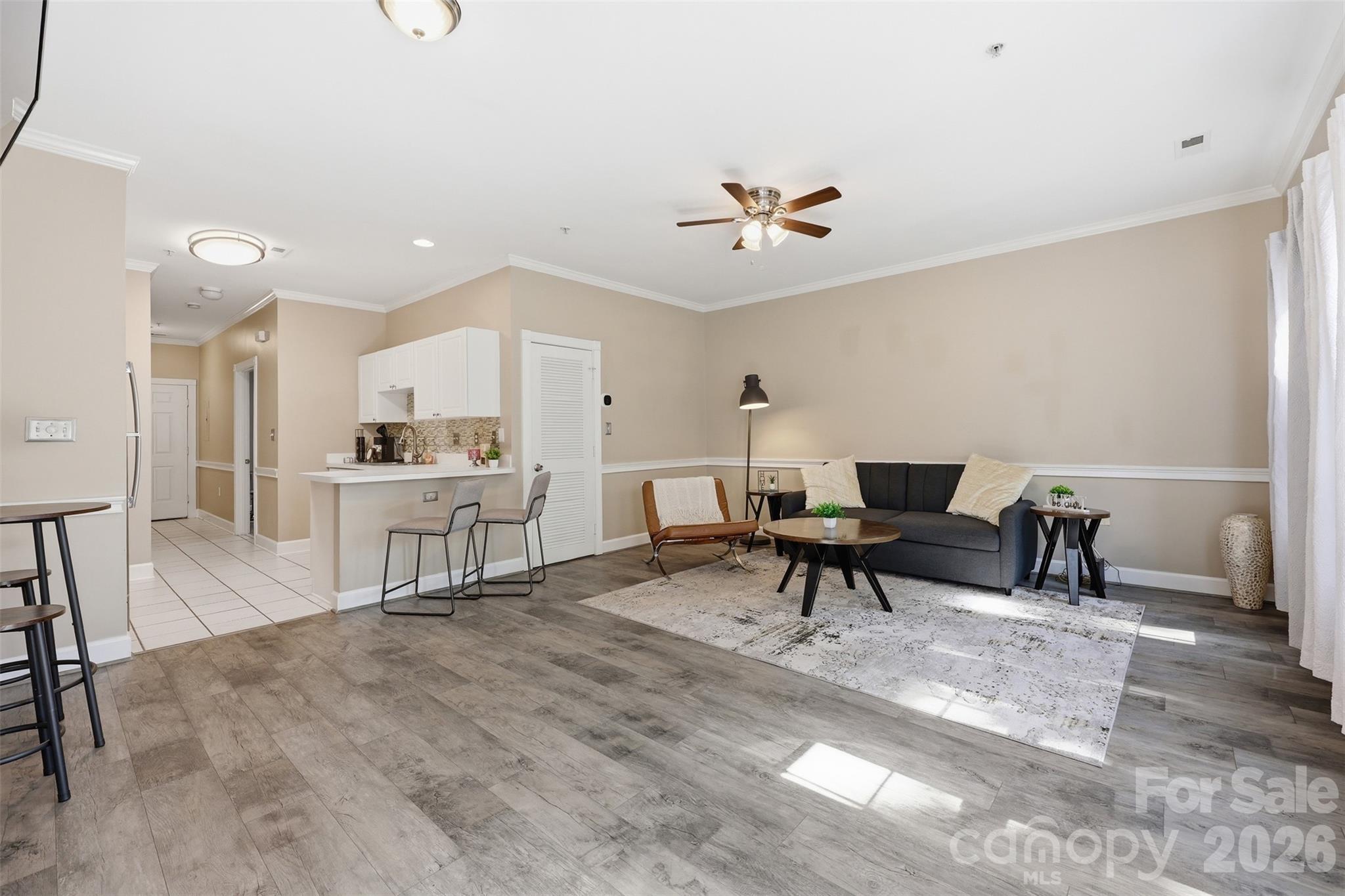 9054 Meadow Vista Road Charlotte, NC 28213 - Photo 12 of 30 a living room with furniture and kitchen view