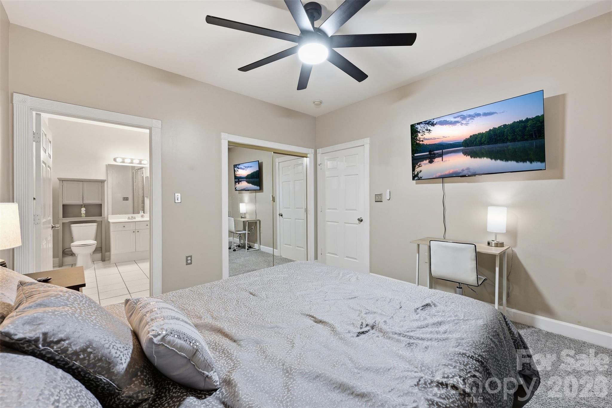 9054 Meadow Vista Road Charlotte, NC 28213 - Photo 20 of 30 a bedroom with a bed and a flat screen tv