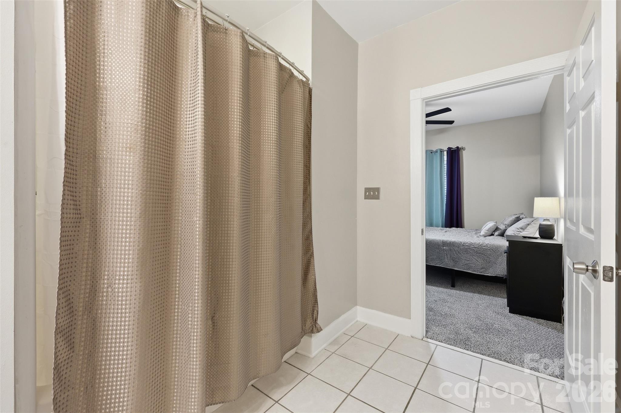 9054 Meadow Vista Road Charlotte, NC 28213 - Photo 22 of 30 a bedroom with a bed and a shower