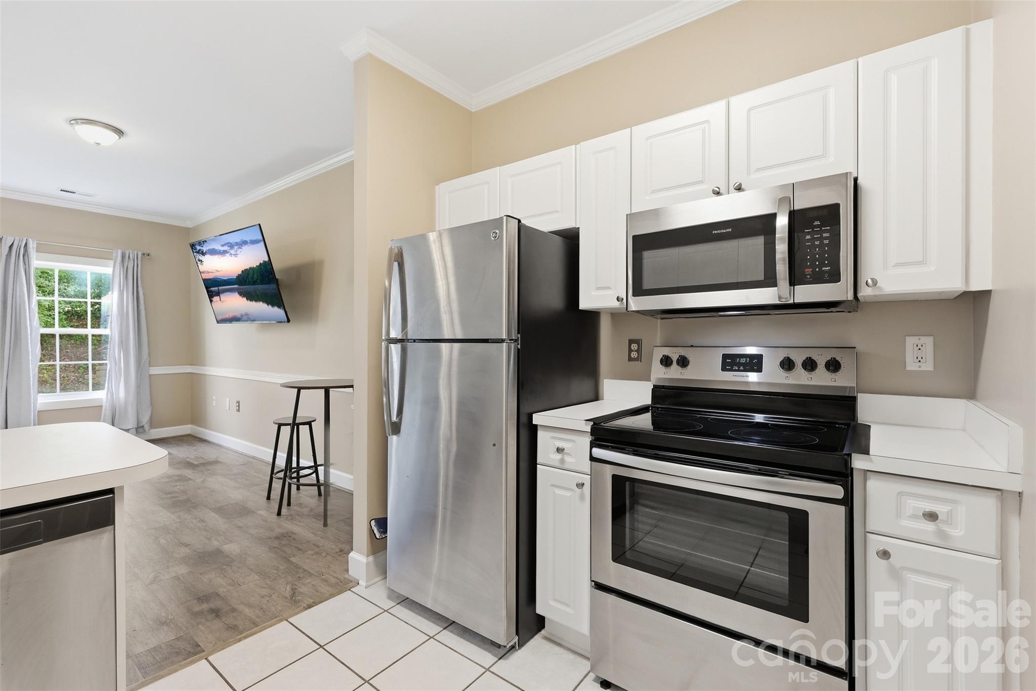 9054 Meadow Vista Road Charlotte, NC 28213 - Photo 8 of 30 a kitchen with cabinets stainless steel appliances and a counter top space