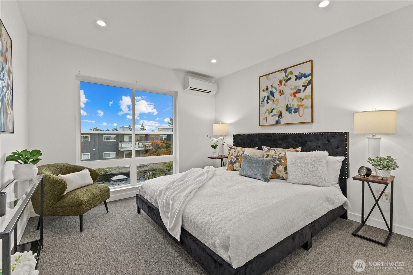 5439 California Avenue Southwest, Unit H Seattle, WA 98136 - Photo 16 of 23 a bedroom with a bed and painting on the wall
