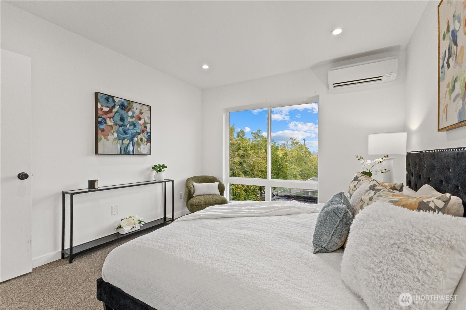 5439 California Avenue Southwest, Unit H Seattle, WA 98136 - Photo 17 of 23 a bedroom with a bed and a large window