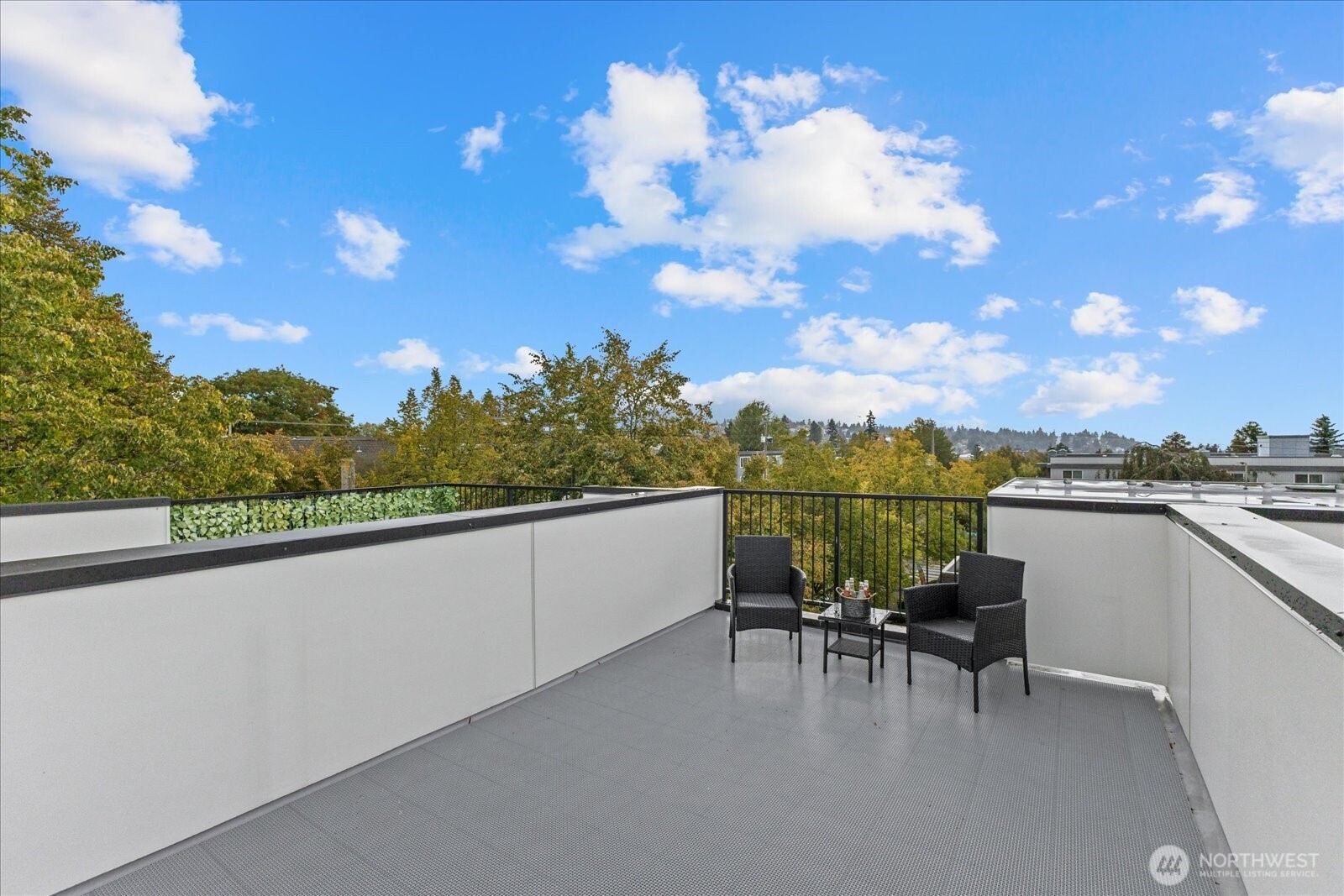 5439 California Avenue Southwest, Unit H Seattle, WA 98136 - Photo 21 of 23 a view of a terrace with furniture and a potted plant