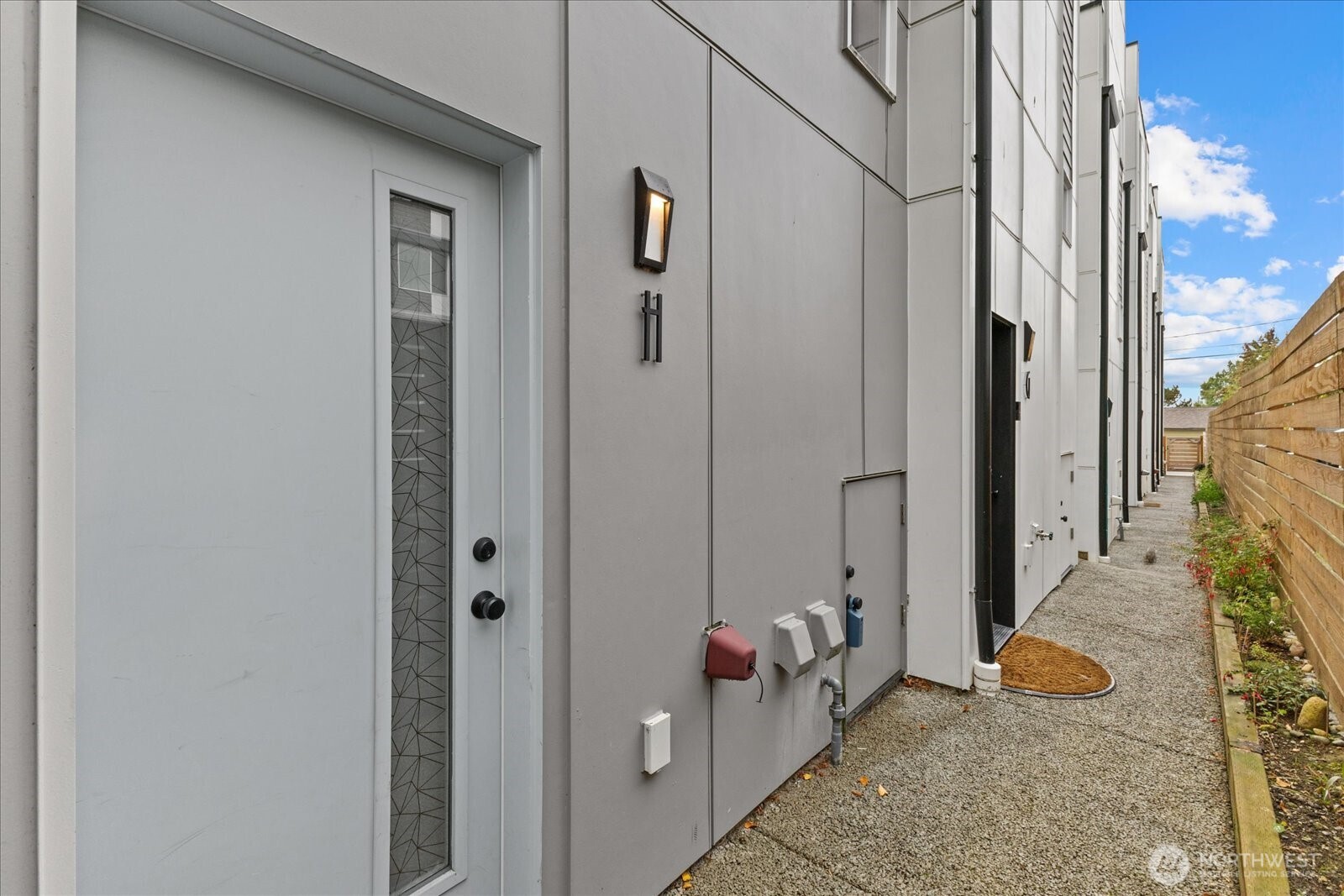 5439 California Avenue Southwest, Unit H Seattle, WA 98136 - Photo 23 of 23 a view of a door and chair in the balcony