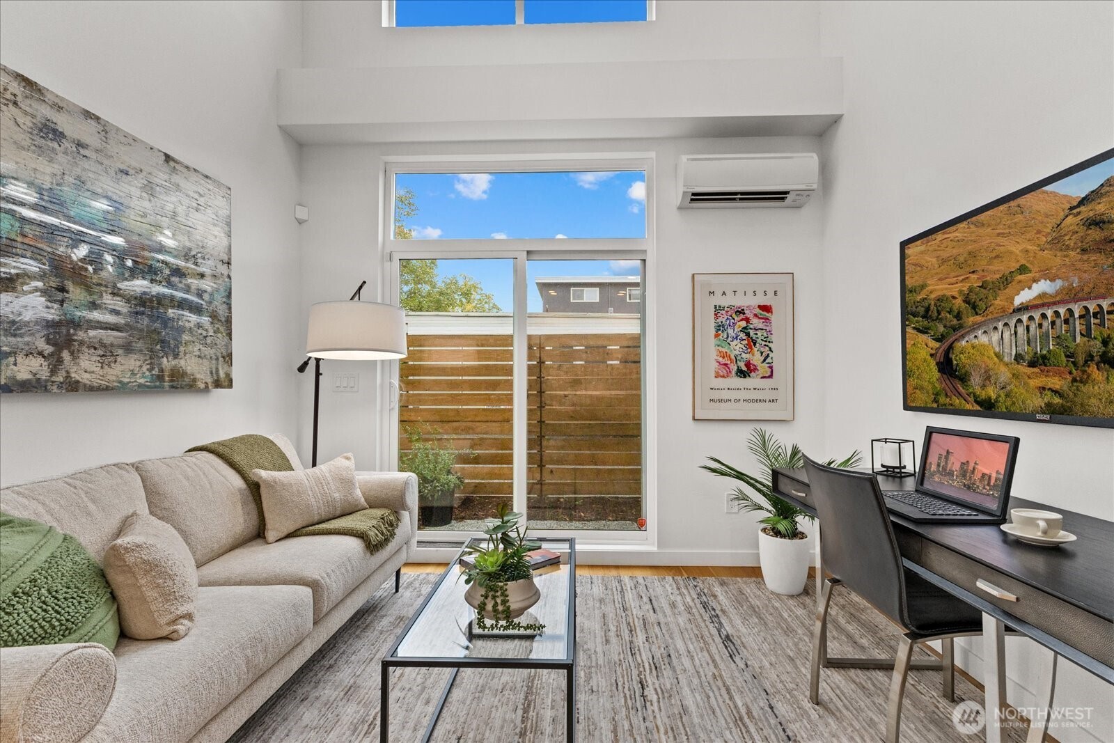 5439 California Avenue Southwest, Unit H Seattle, WA 98136 - Photo 3 of 23 a living room with furniture and a flat screen tv