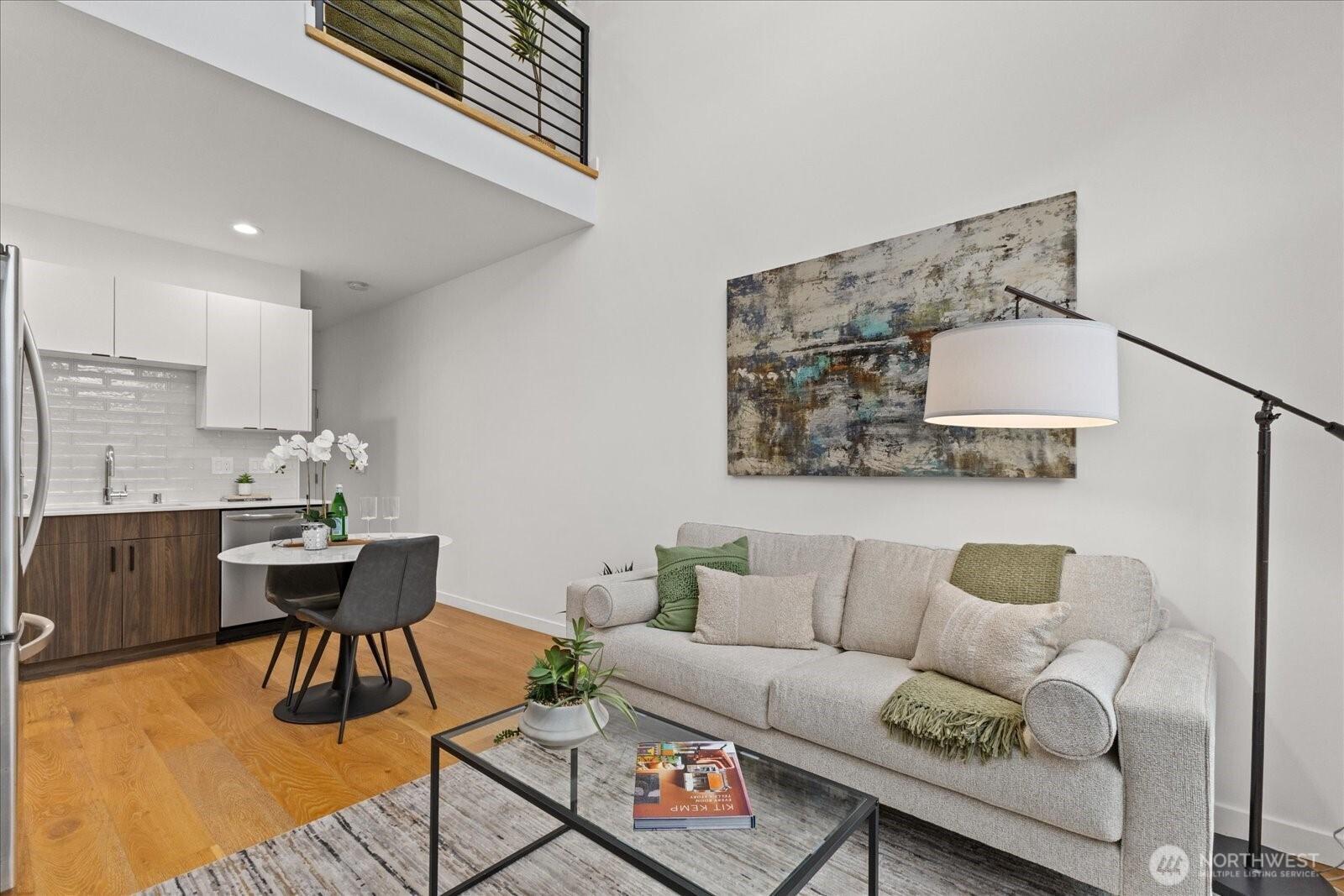 5439 California Avenue Southwest, Unit H Seattle, WA 98136 - Photo 4 of 23 a living room with furniture and wooden floor