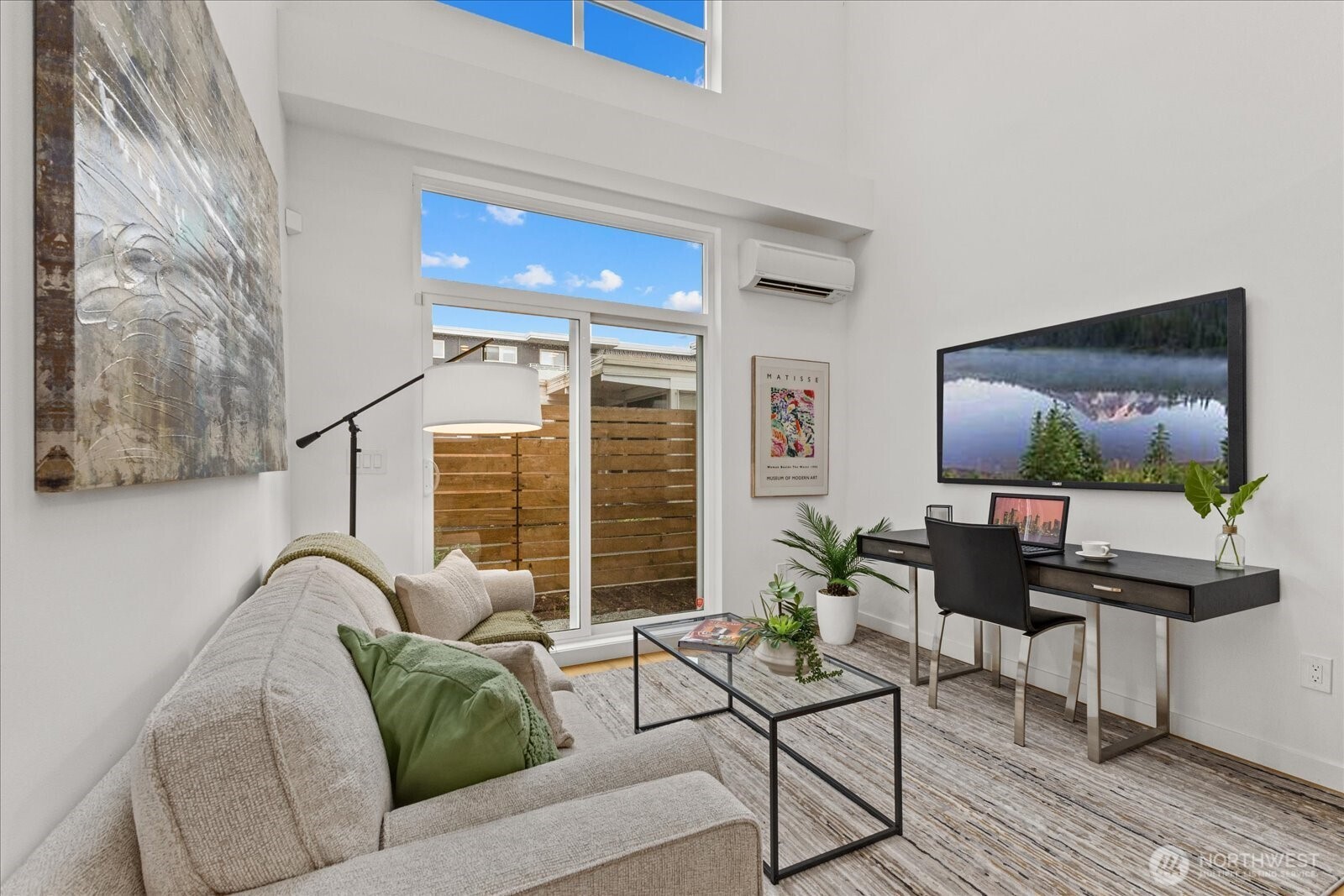 5439 California Avenue Southwest, Unit H Seattle, WA 98136 - Photo 6 of 23 a living room with furniture and a flat screen tv