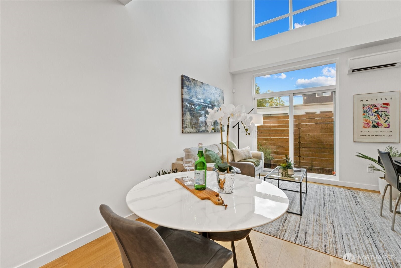5439 California Avenue Southwest, Unit H Seattle, WA 98136 - Photo 9 of 23 a dining room with furniture and wooden floor