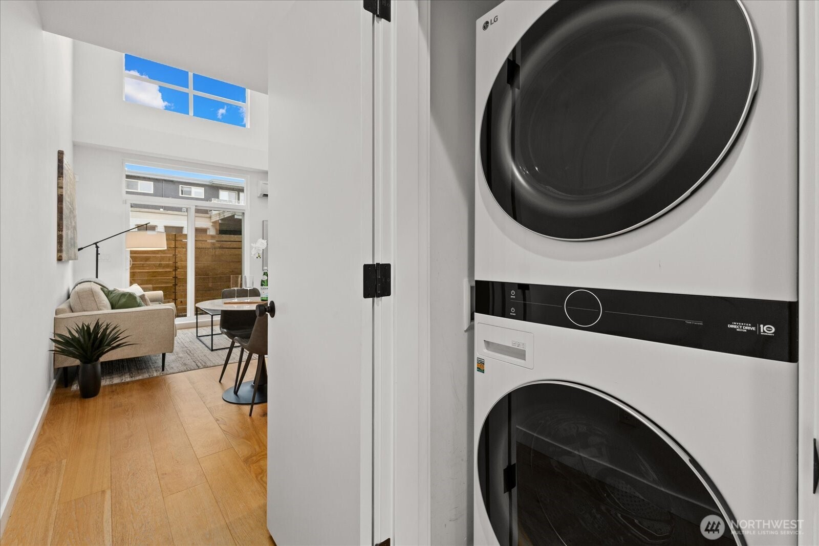 5439 California Avenue Southwest, Unit H Seattle, WA 98136 - Photo 10 of 23 a view of a living room with washer and dryer