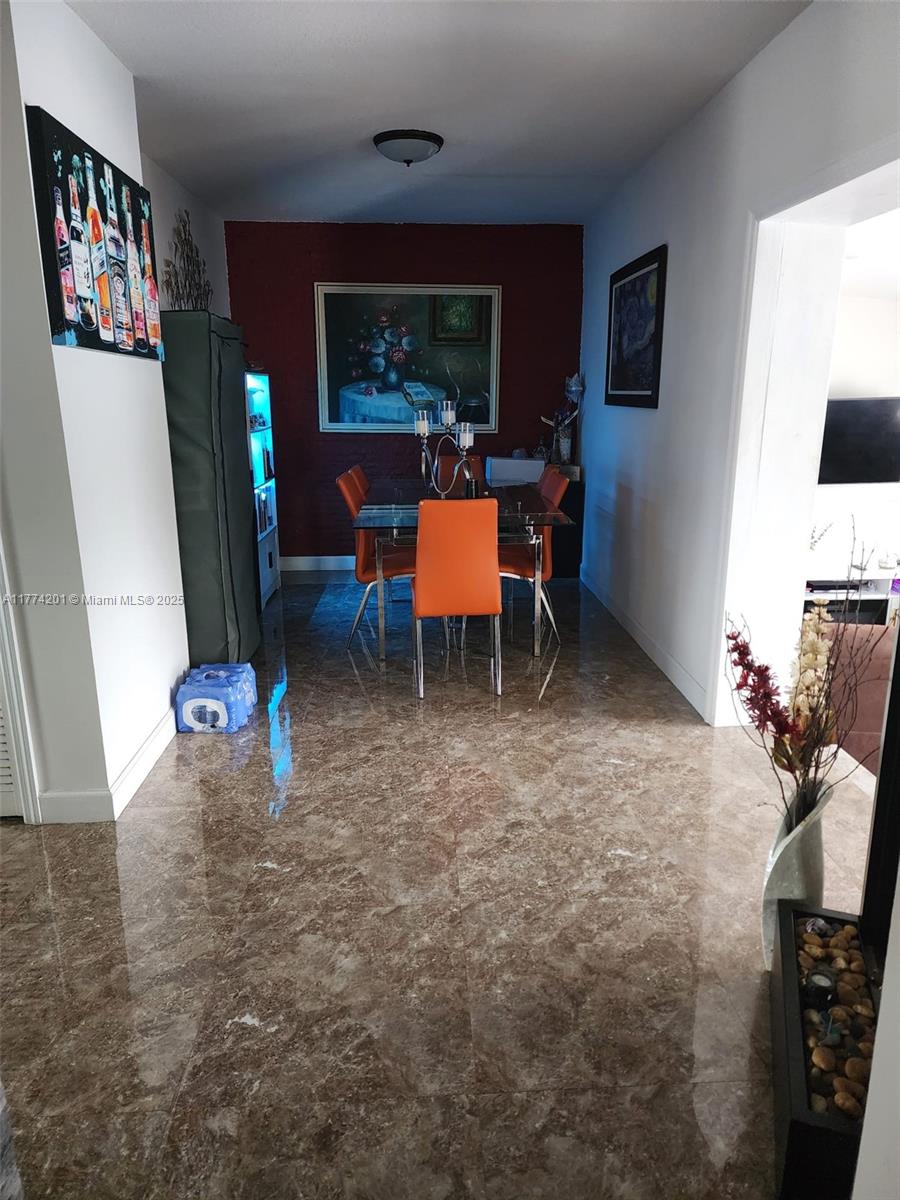 341 West 59th Street Hialeah, FL 33012 - Photo 13 of 44 a living room with furniture and a flat screen tv