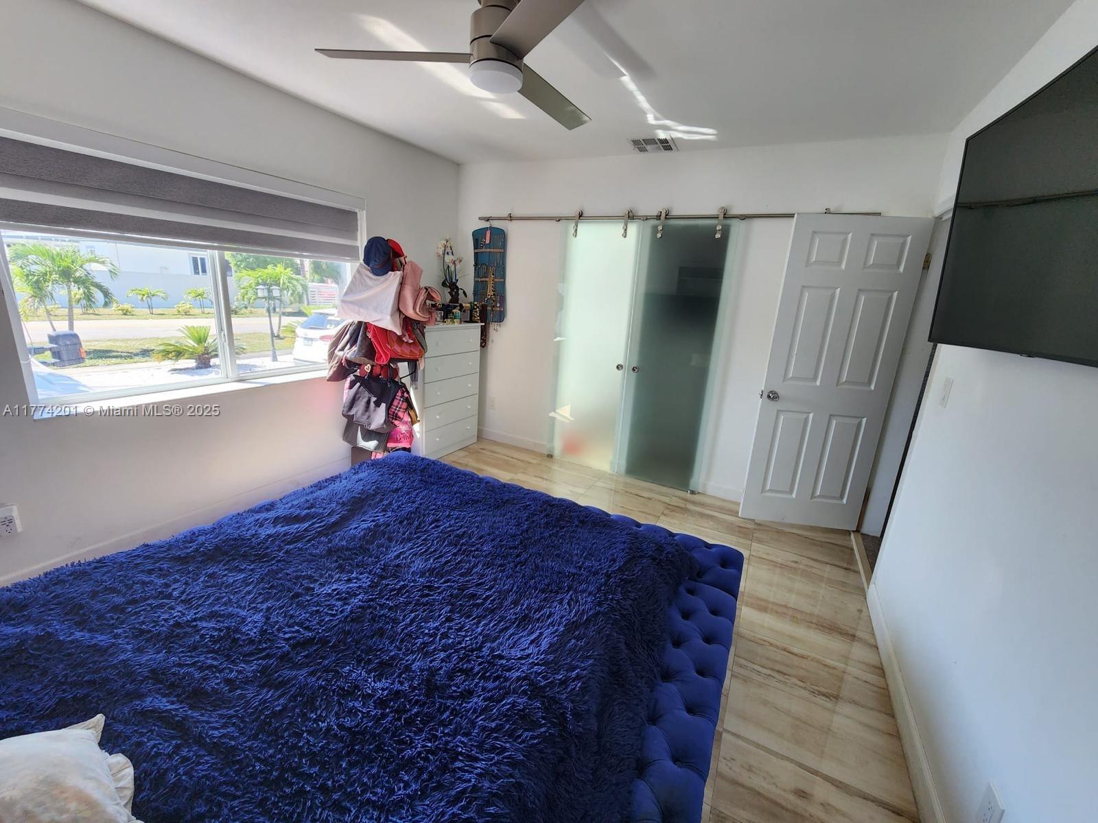 341 West 59th Street Hialeah, FL 33012 - Photo 17 of 44 a very nice looking room with a large window