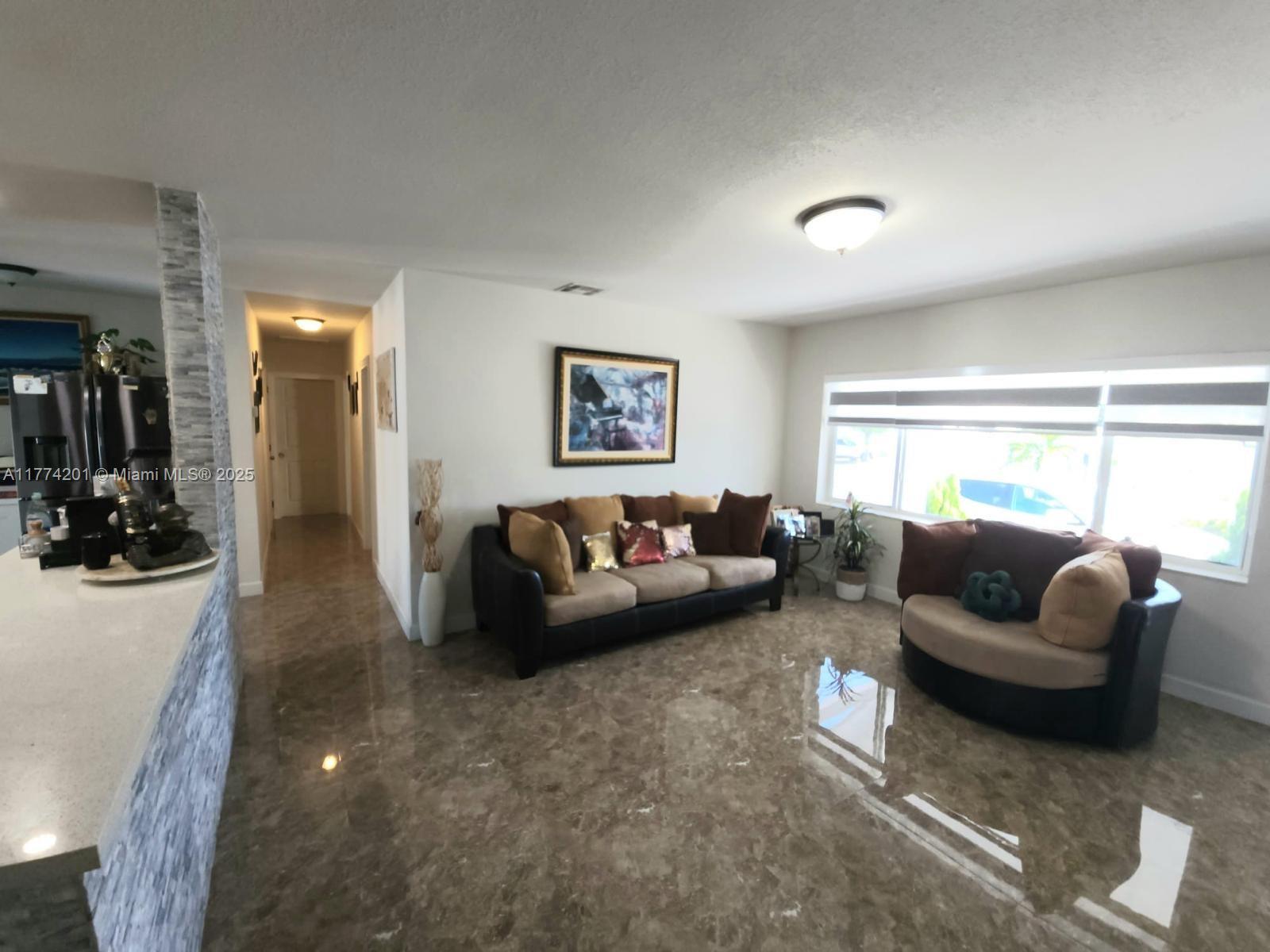 341 West 59th Street Hialeah, FL 33012 - Photo 25 of 44 a living room with furniture and a window
