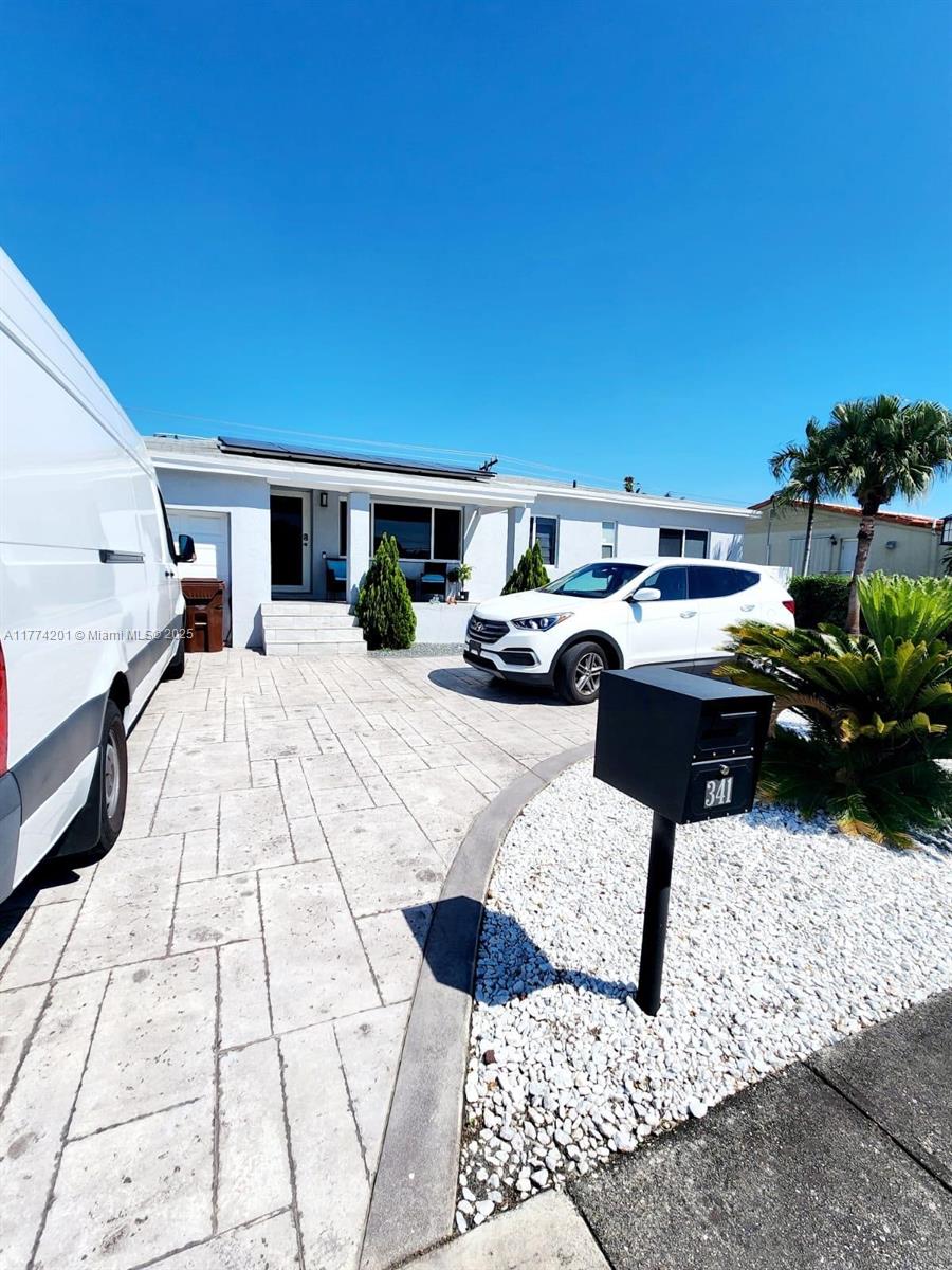 341 West 59th Street Hialeah, FL 33012 - Photo 3 of 44 a view of a terrace with couches and potted plants