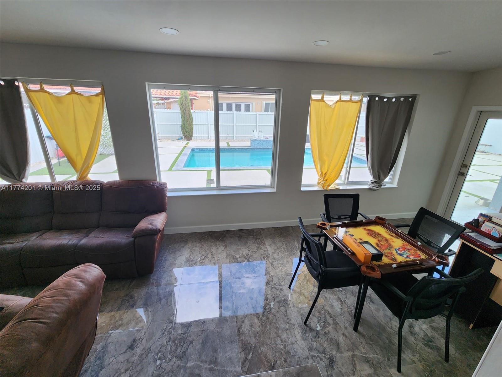 341 West 59th Street Hialeah, FL 33012 - Photo 36 of 44 a living room with furniture and a window