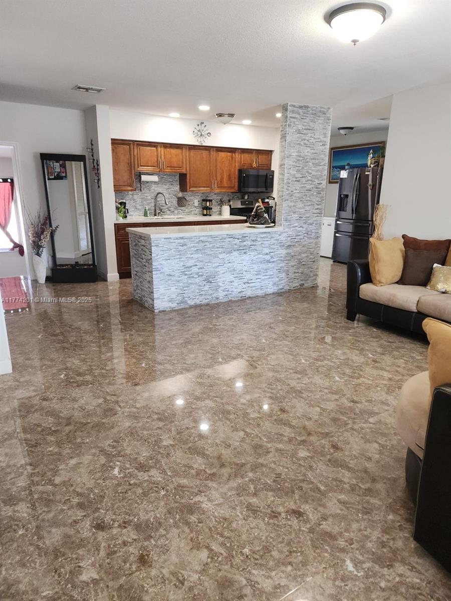 341 West 59th Street Hialeah, FL 33012 - Photo 8 of 44 a view of a living room