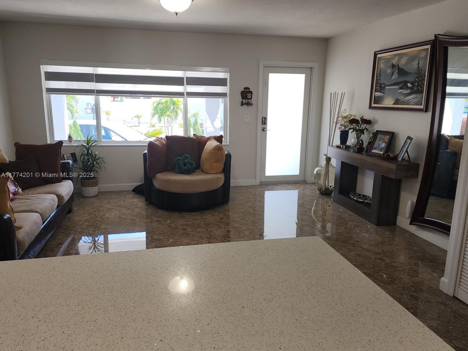 341 West 59th Street Hialeah, FL 33012 - Photo 9 of 44 a living room with furniture and a window