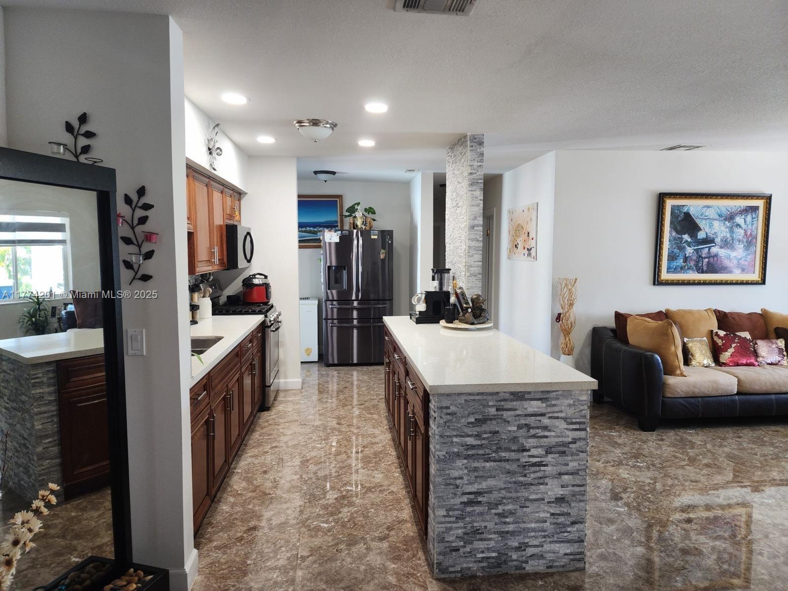 341 West 59th Street Hialeah, FL 33012 - Photo 10 of 44 a very nice looking room with a large mirror