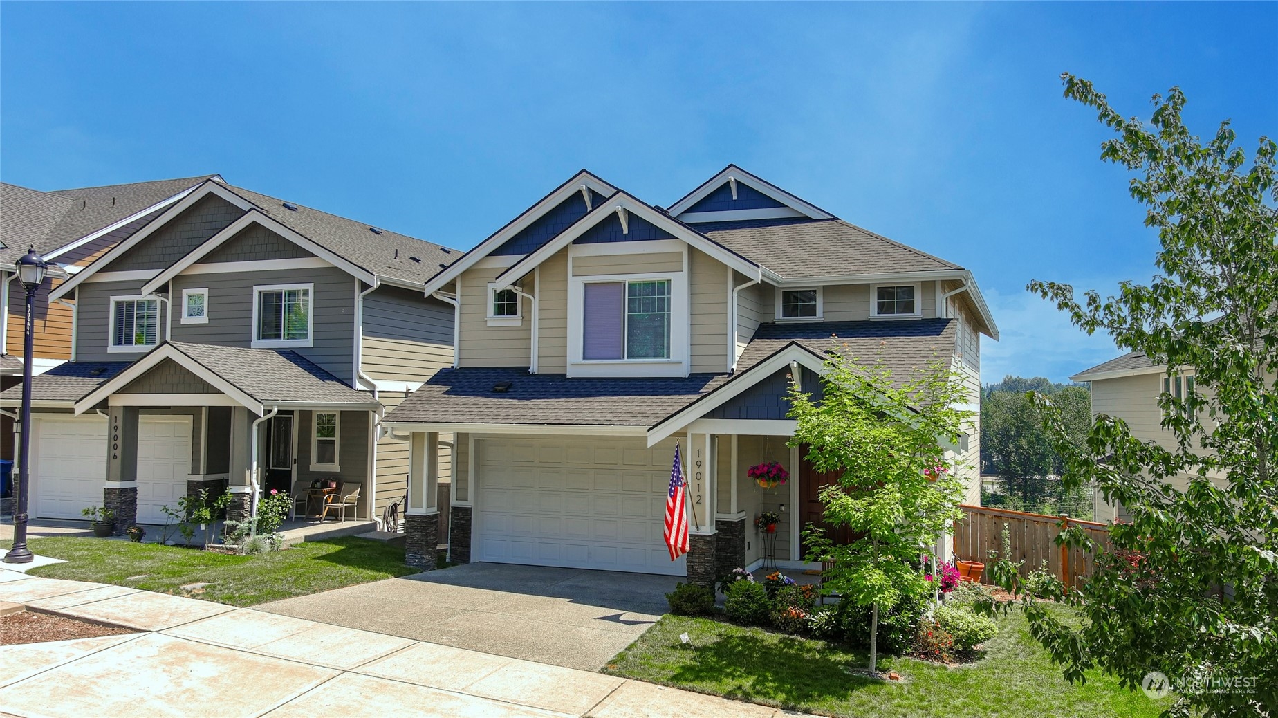a front view of house with yard and green space