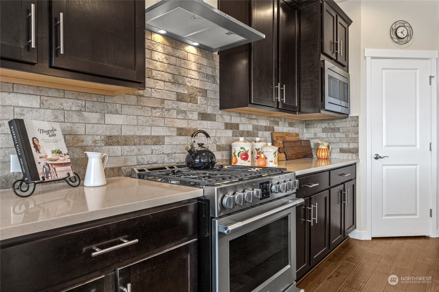19012 123rd Avenue Southeast Renton, WA 98058 - Photo 16 of 40 a stove top oven sitting inside of a kitchen