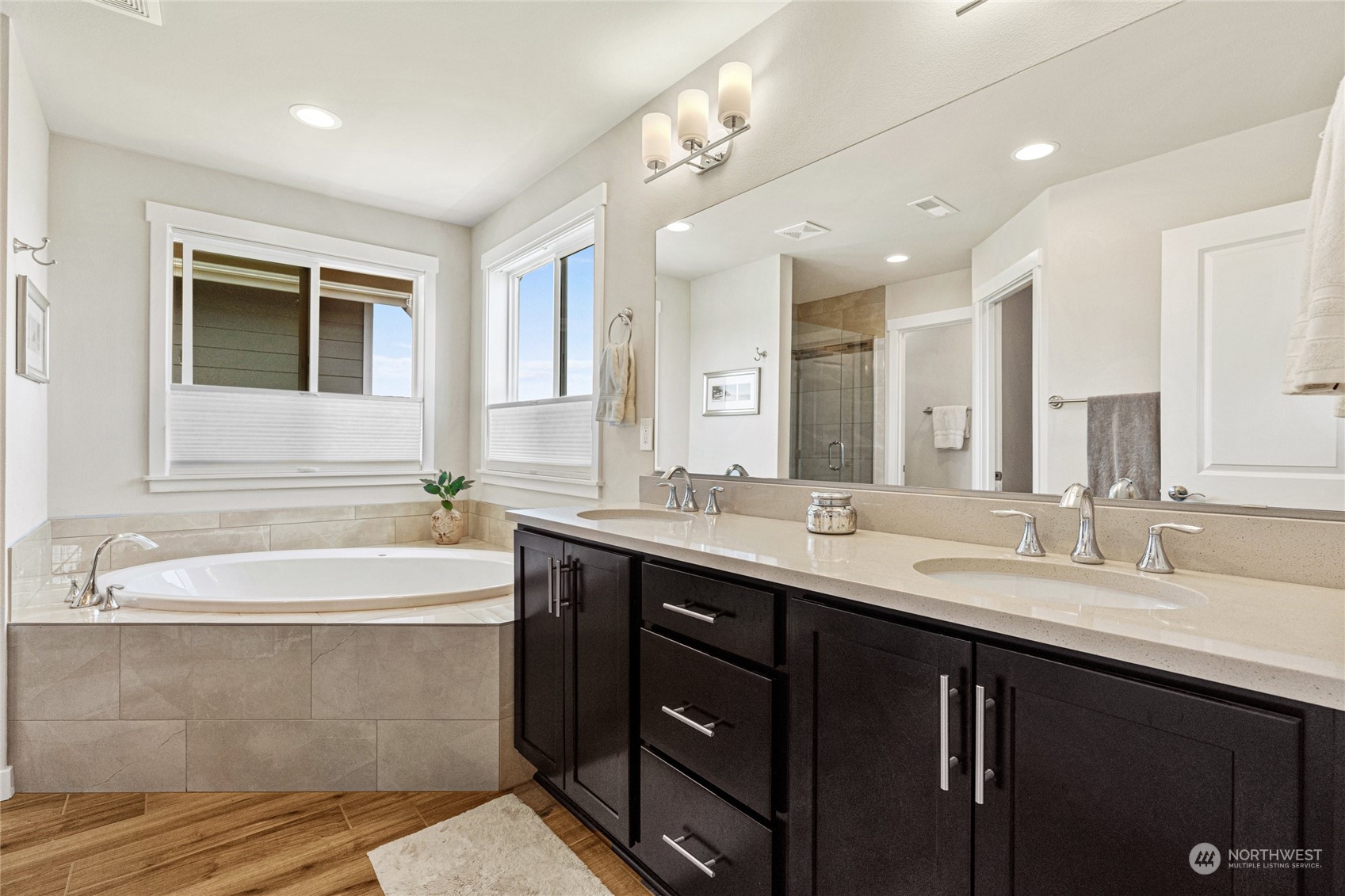 19012 123rd Avenue Southeast Renton, WA 98058 - Photo 19 of 40 a bathroom with a double vanity sink mirror and bathtub
