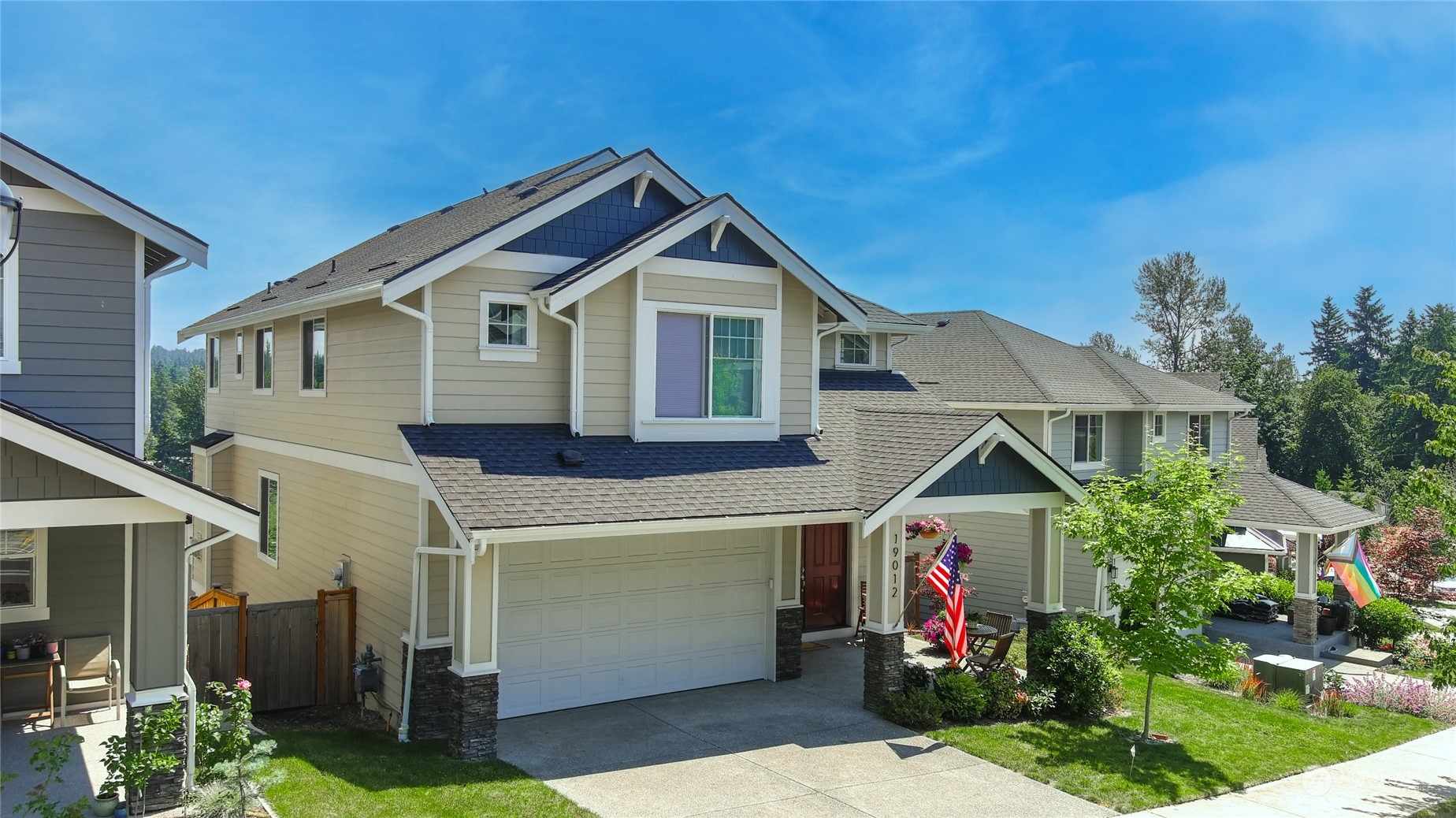 19012 123rd Avenue Southeast Renton, WA 98058 - Photo 2 of 40 a front view of a house with garden