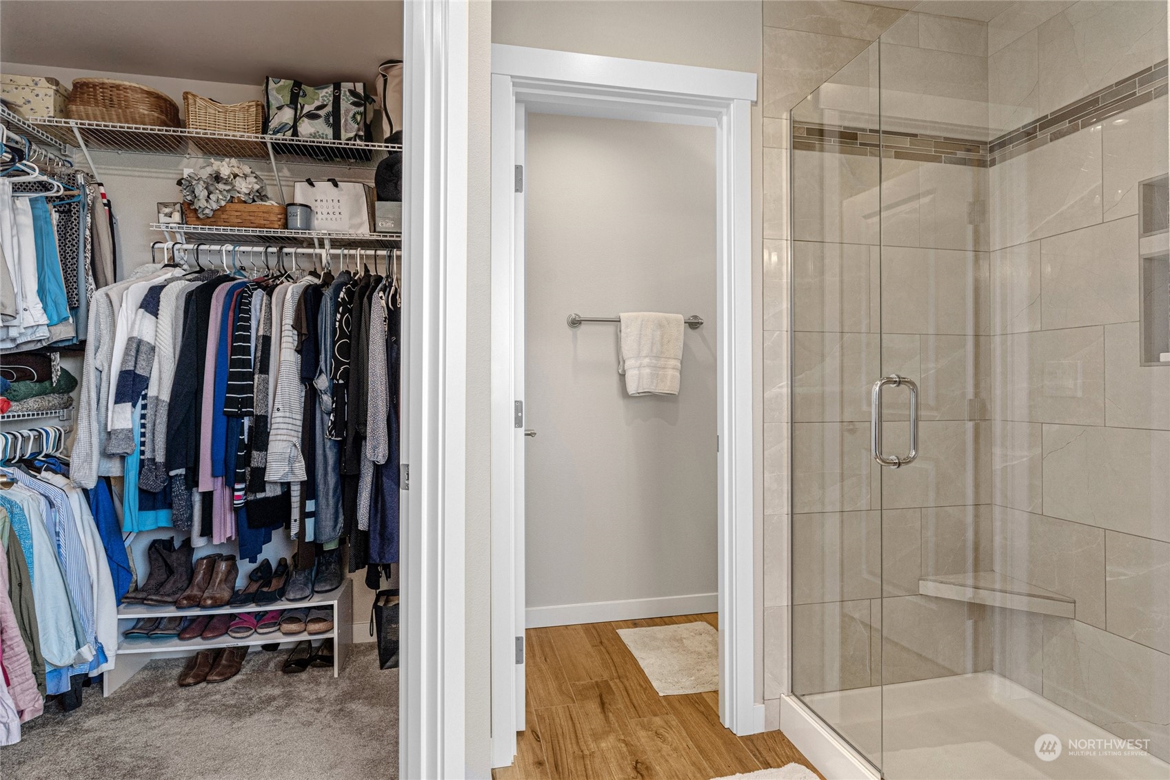 19012 123rd Avenue Southeast Renton, WA 98058 - Photo 21 of 40 a view of walk in closet with clothes and shoes