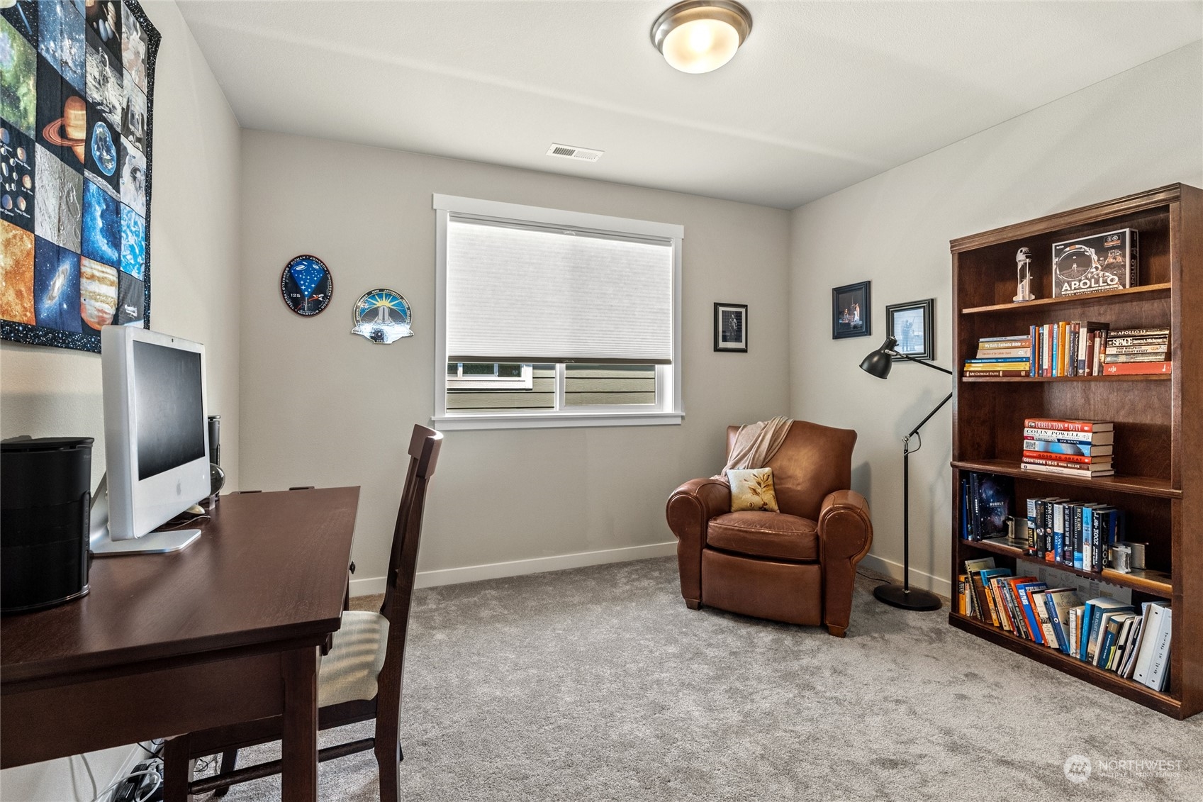19012 123rd Avenue Southeast Renton, WA 98058 - Photo 23 of 40 a living room with furniture and a bookshelf