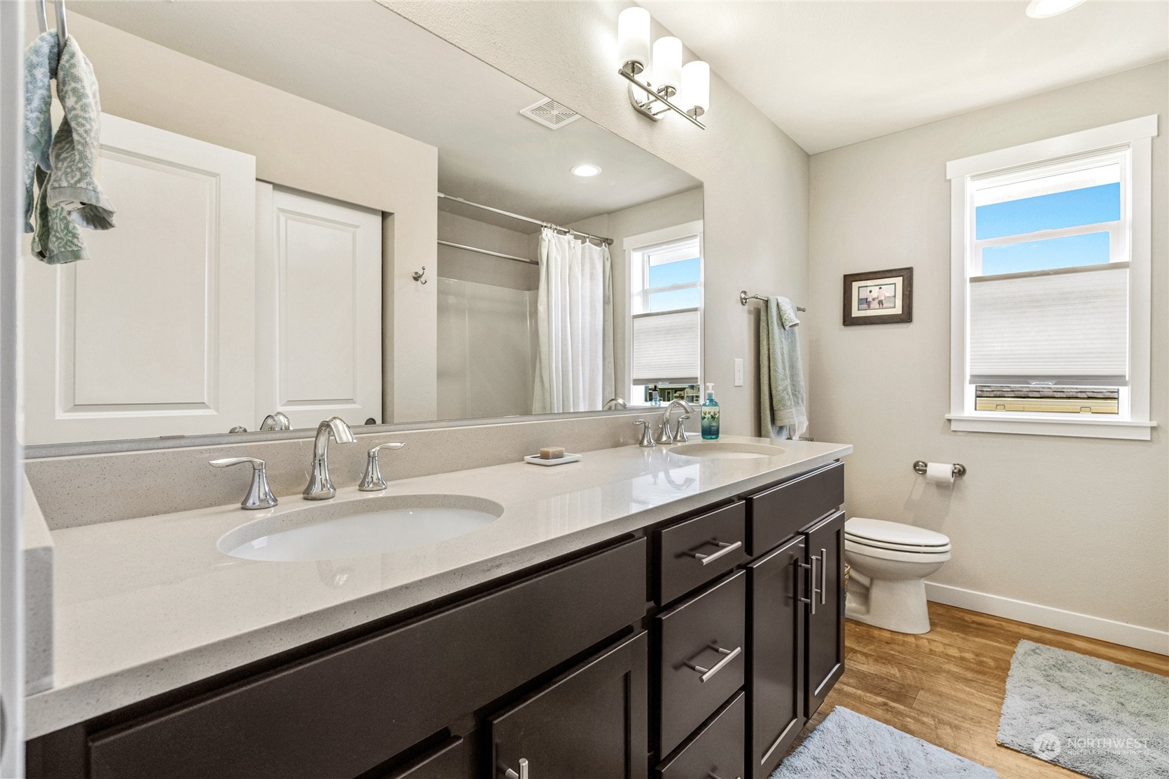 19012 123rd Avenue Southeast Renton, WA 98058 - Photo 24 of 40 a bathroom with a double vanity sink and a mirror