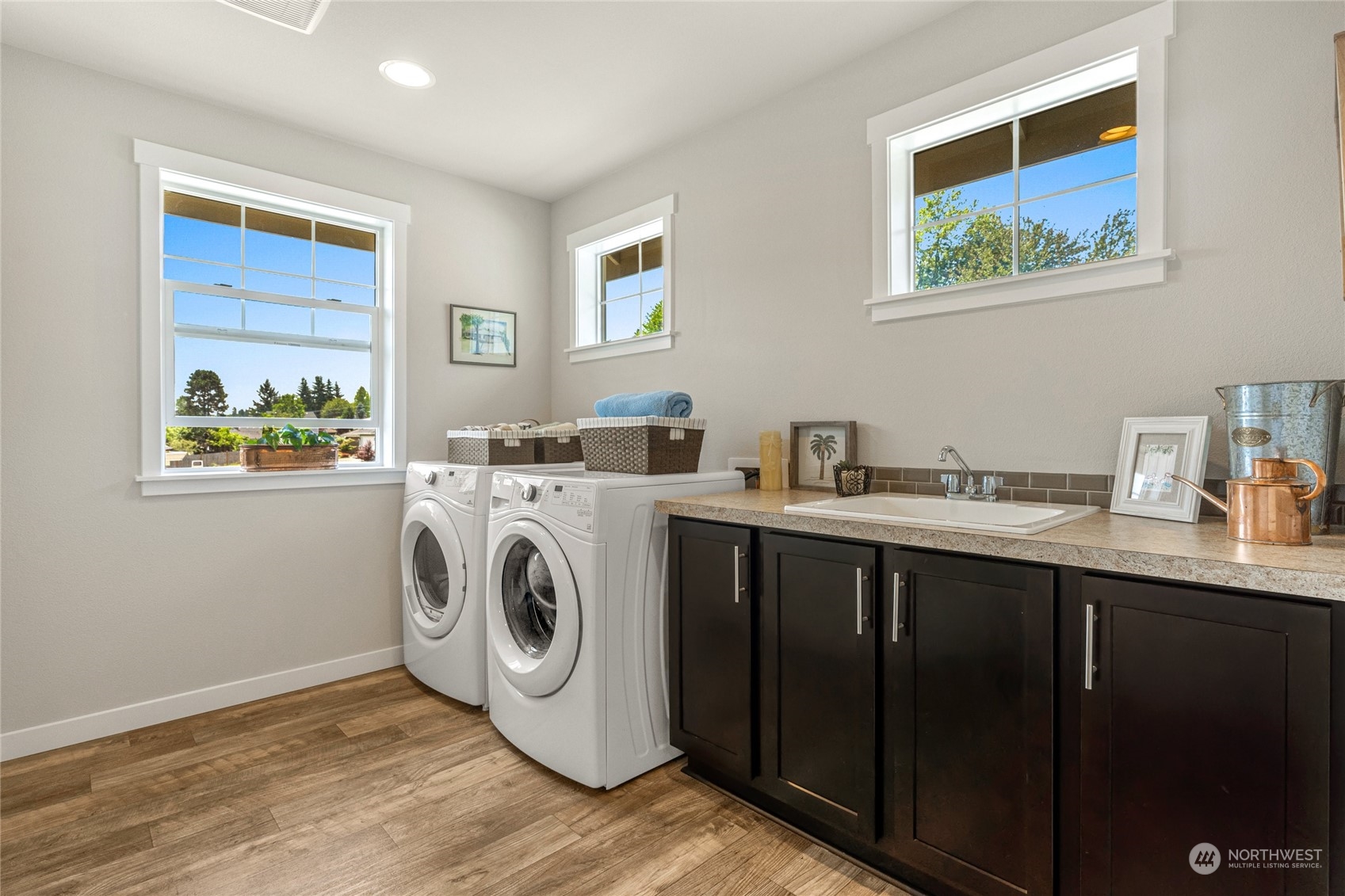 19012 123rd Avenue Southeast Renton, WA 98058 - Photo 25 of 40 a utility room with sink dryer and washer