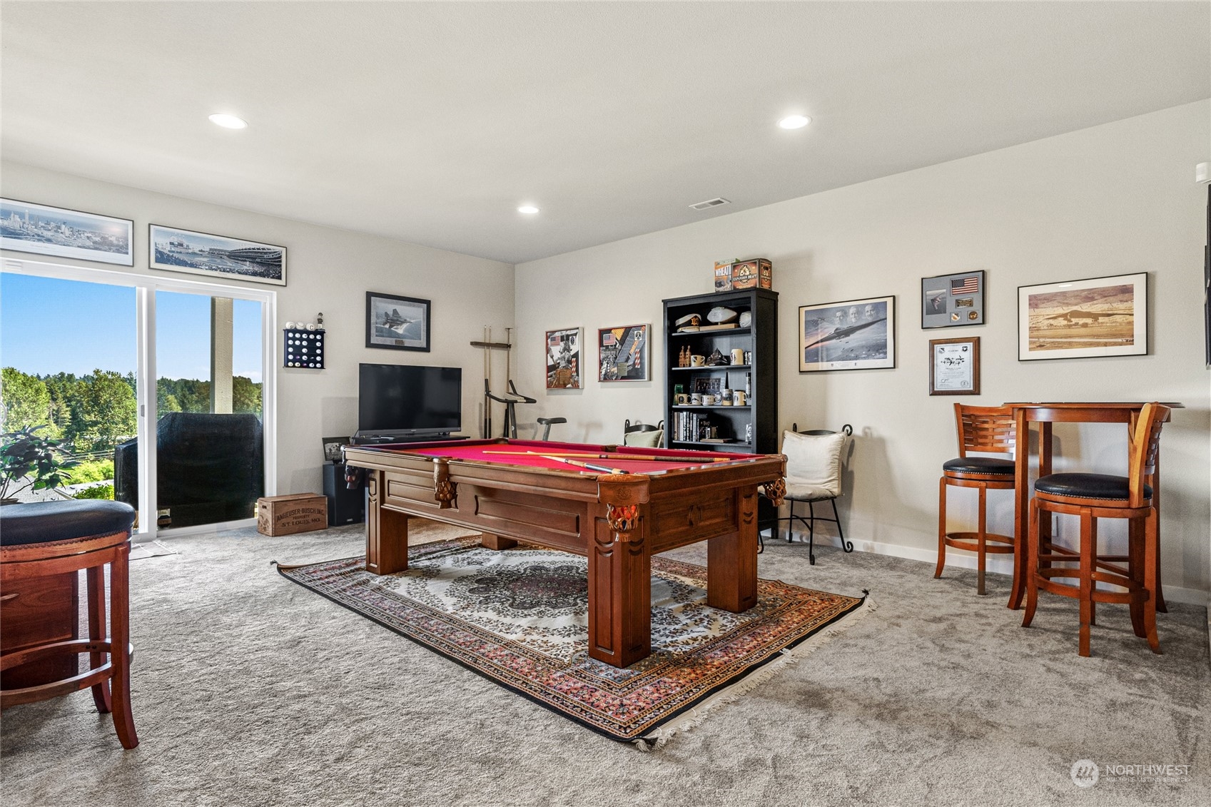 19012 123rd Avenue Southeast Renton, WA 98058 - Photo 30 of 40 a living room with furniture a flat screen tv and a table