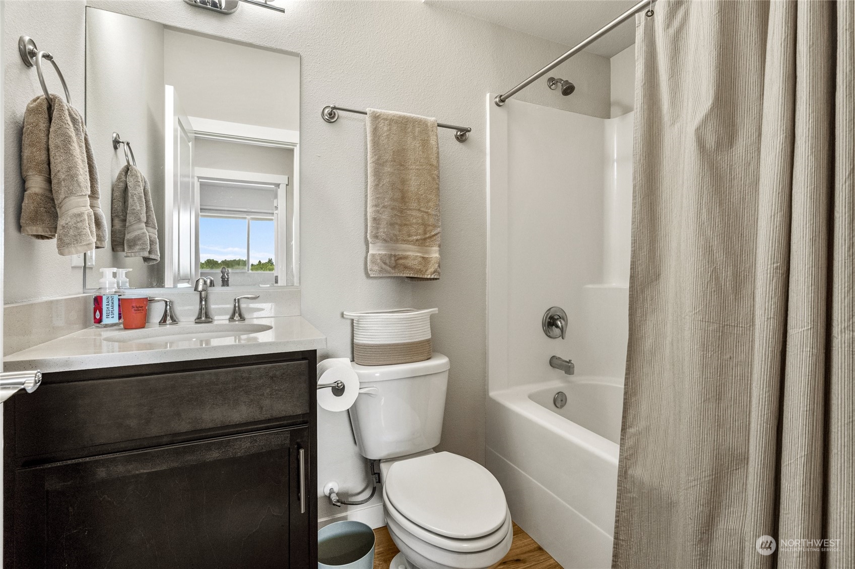19012 123rd Avenue Southeast Renton, WA 98058 - Photo 33 of 40 a bathroom with a sink a toilet a mirror a vanity and shower