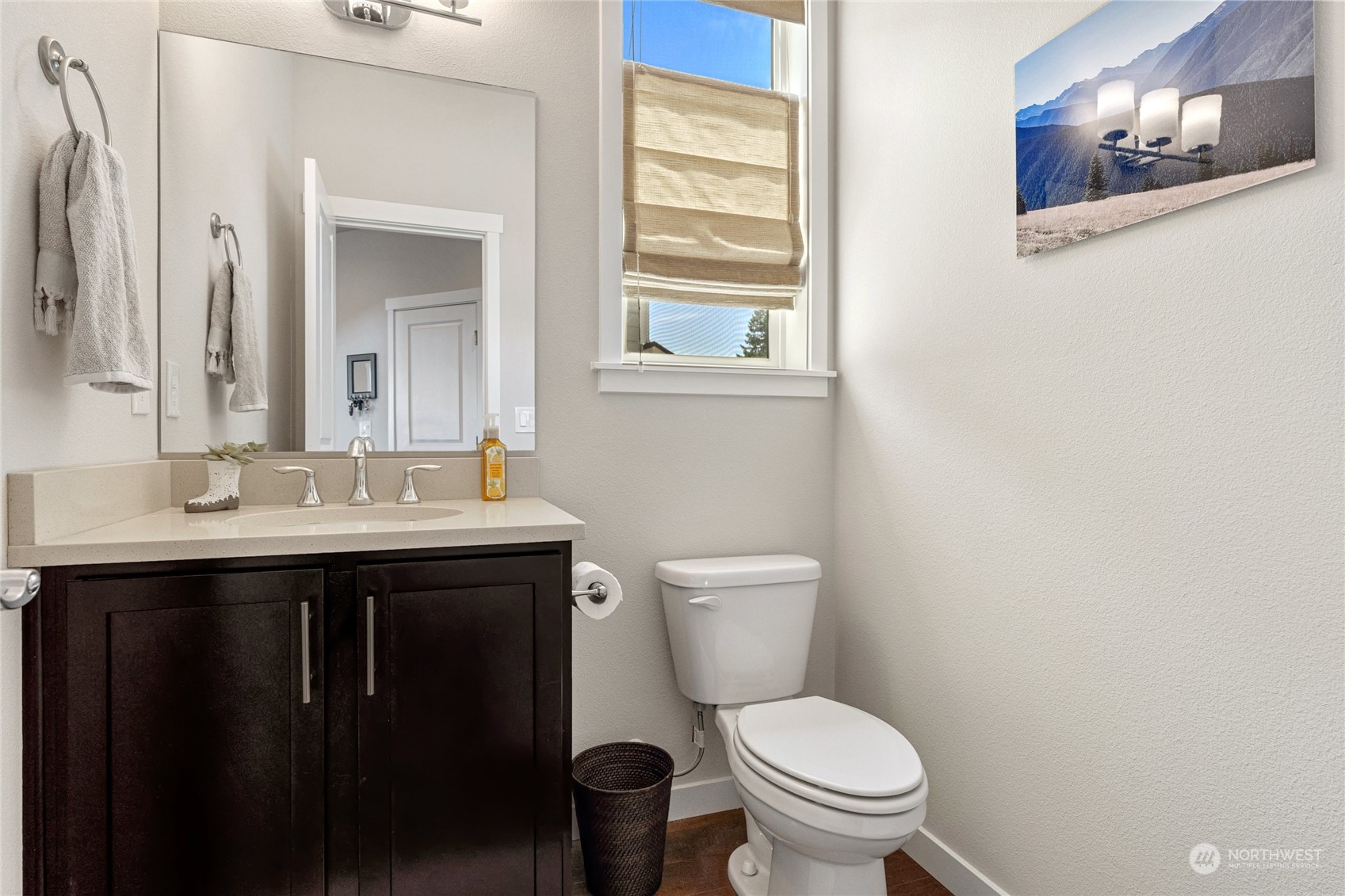 19012 123rd Avenue Southeast Renton, WA 98058 - Photo 35 of 40 a bathroom with a toilet a sink and mirror