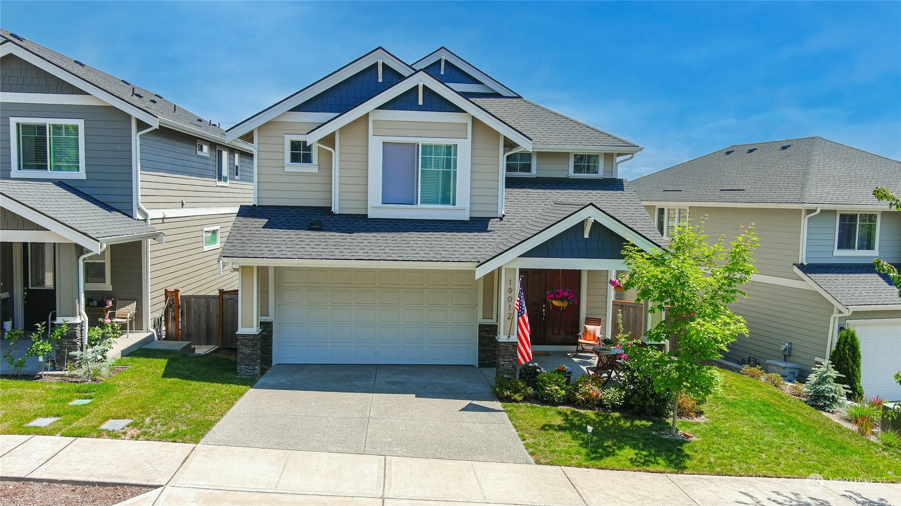 19012 123rd Avenue Southeast Renton, WA 98058 - Photo 40 of 40 a front view of a house with garden