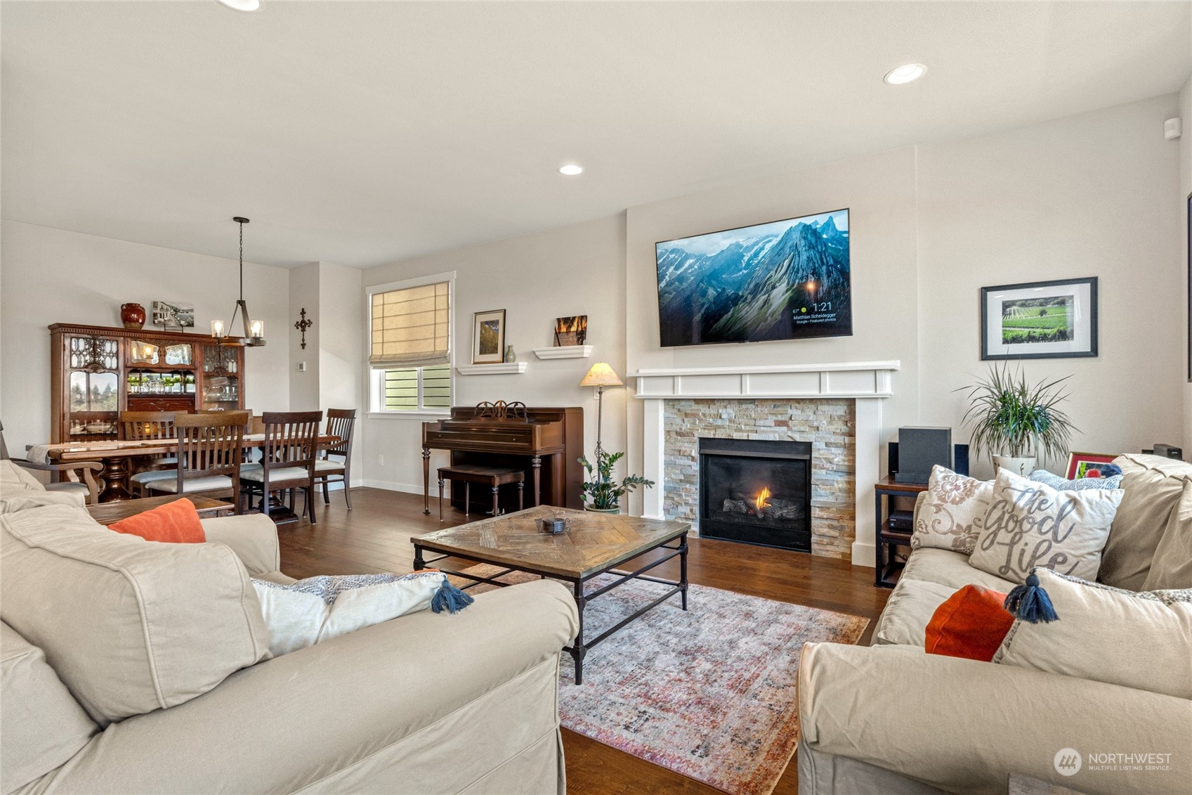 19012 123rd Avenue Southeast Renton, WA 98058 - Photo 10 of 40 a living room with furniture a fireplace and a flat screen tv