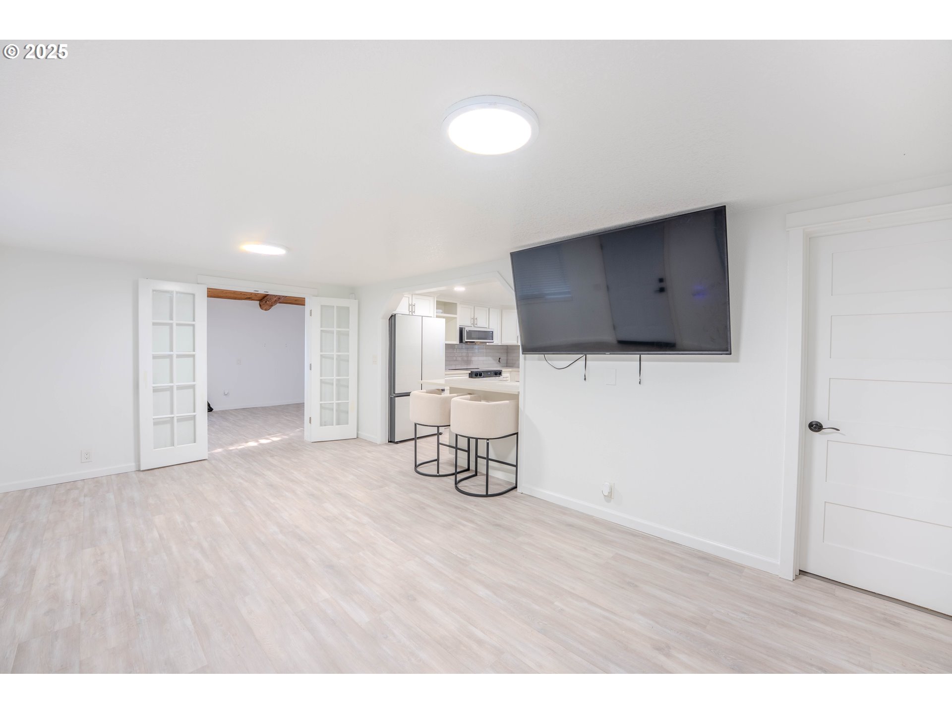15550 Southeast Tickle Creek Road Boring, OR 97009 - Photo 5 of 13 a room with a flat screen tv and white walls
