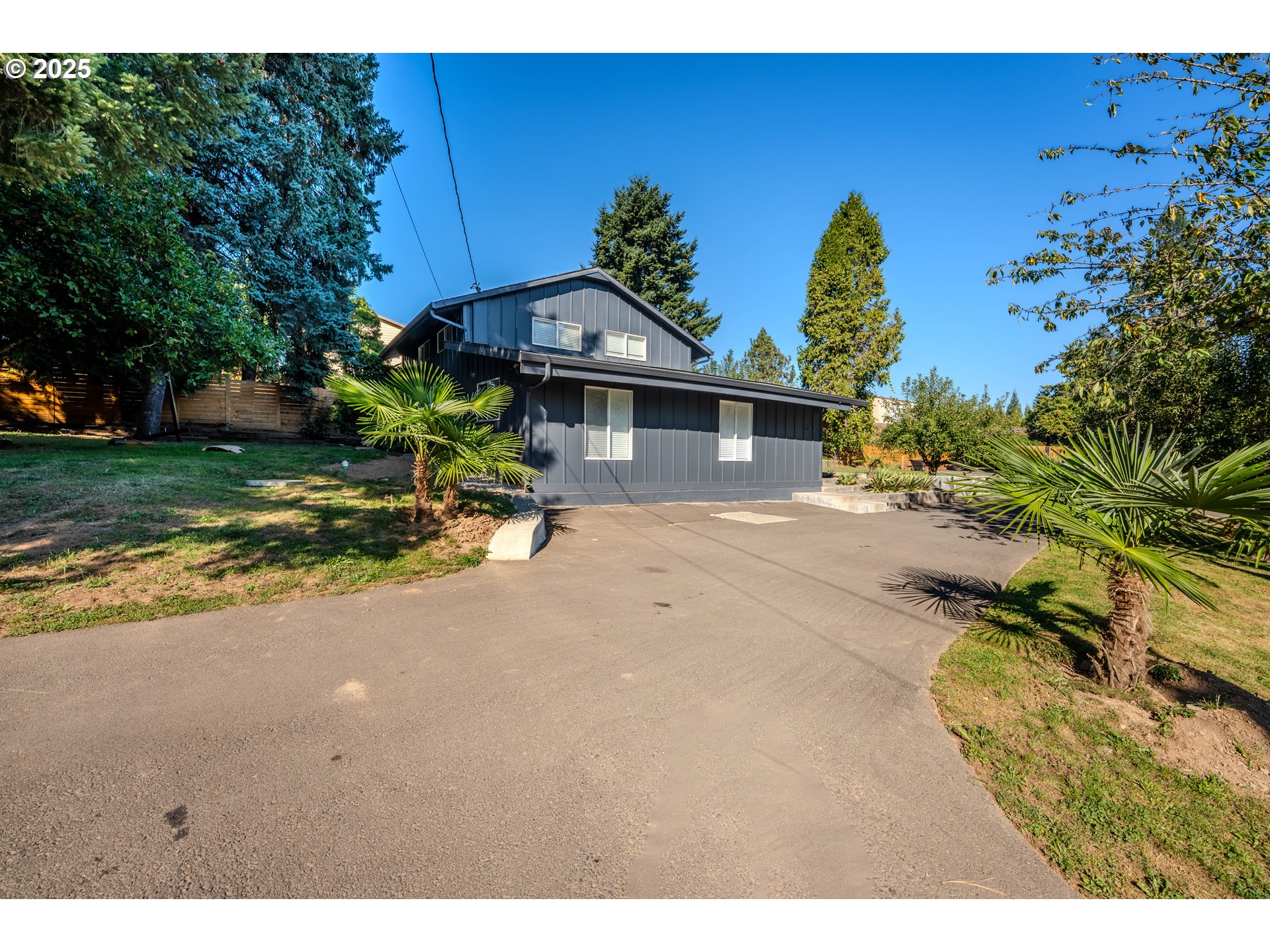 15550 Southeast Tickle Creek Road Boring, OR 97009 - Photo 7 of 13 a view of a house with a yard