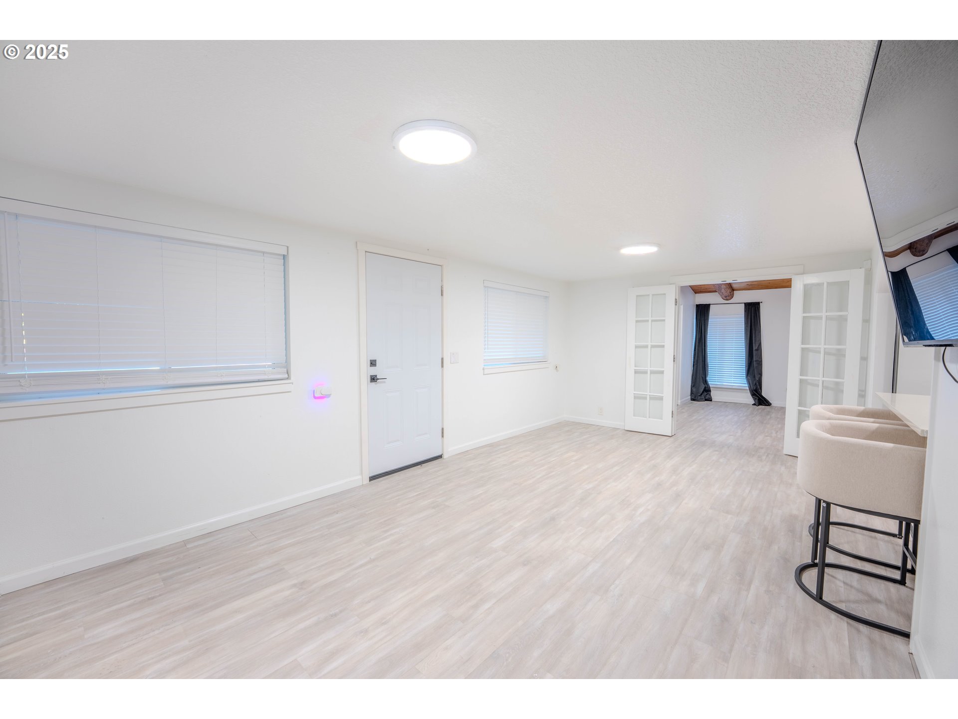 15550 Southeast Tickle Creek Road Boring, OR 97009 - Photo 10 of 13 a view of an empty room with wooden floor