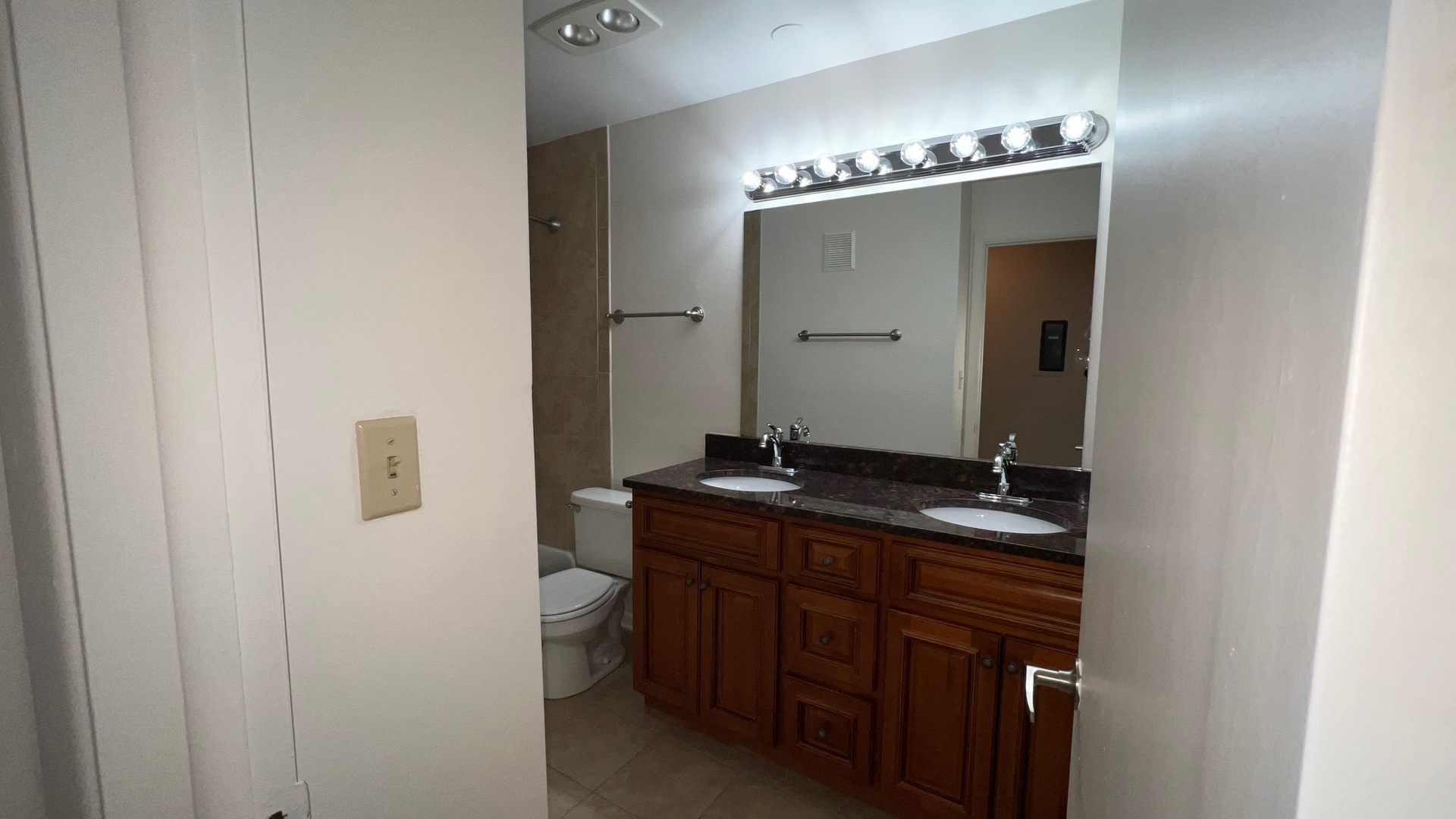 850 South Lorraine Road, Unit 3L Wheaton, IL 60189 - Photo 16 of 21 a bathroom with a double vanity sink and mirror