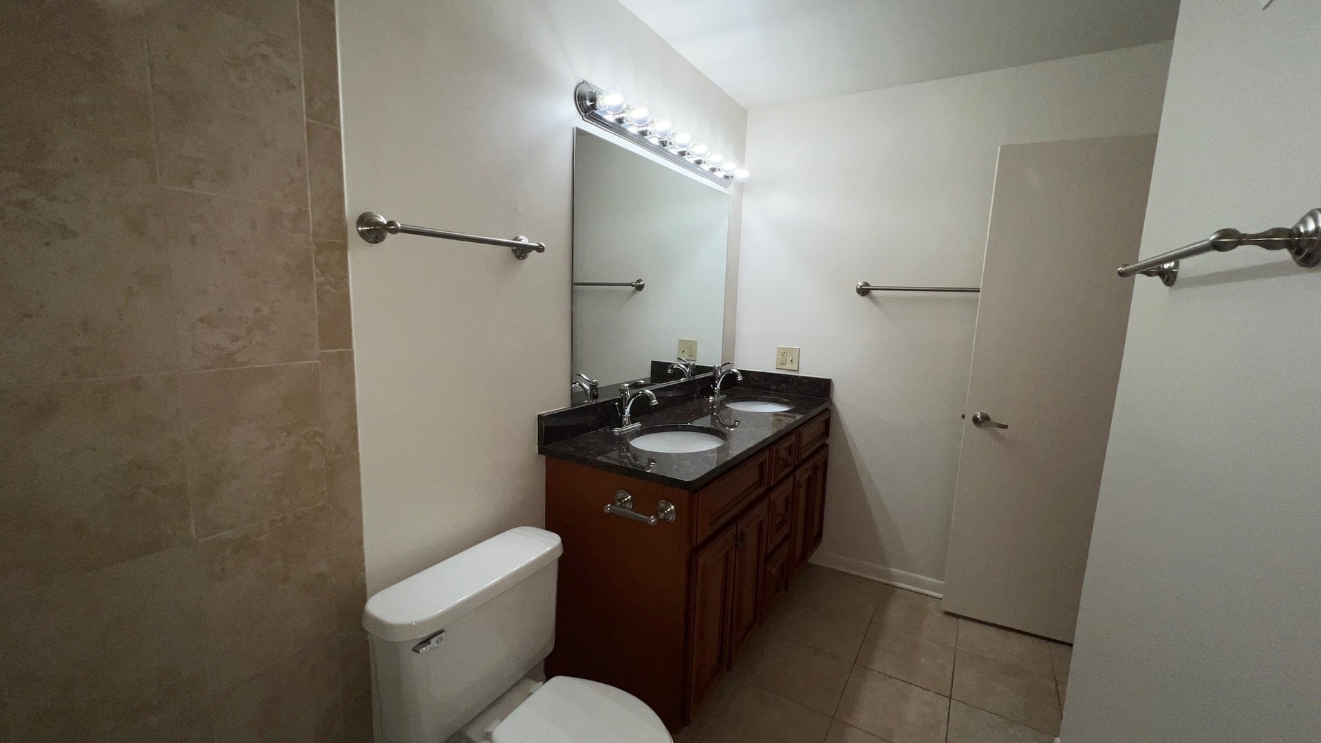 850 South Lorraine Road, Unit 3L Wheaton, IL 60189 - Photo 17 of 21 a bathroom with a granite countertop sink toilet and mirror