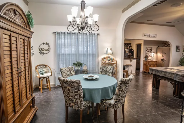 a bathroom with a granite countertop toilet a sink and a mirror