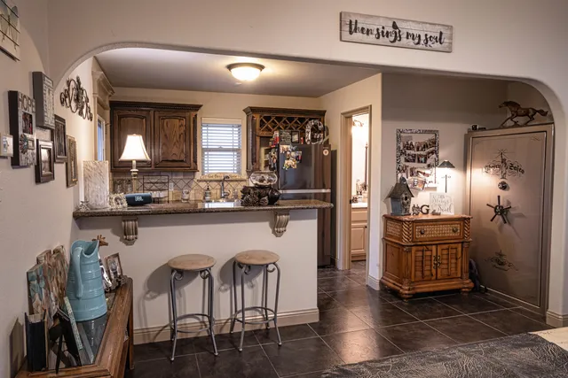 a view of a dining room with furniture wooden floor and chandelier