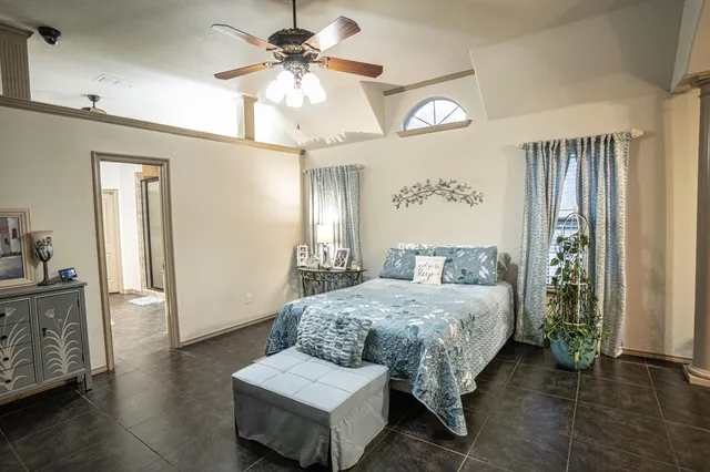 a spacious bathroom with a double vanity sink a mirror and a shower