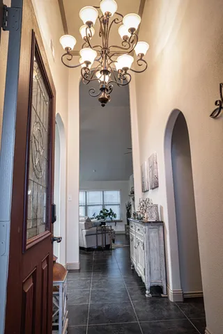 a kitchen with granite countertop a sink stainless steel appliances and cabinets