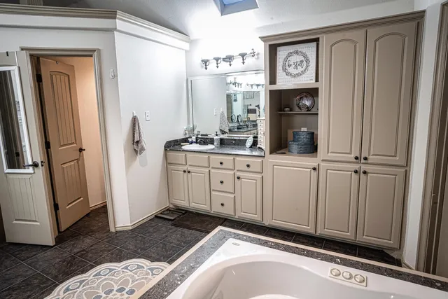 a view of a house with swimming pool and sitting area