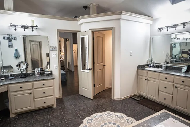 a view of a house with wooden fence