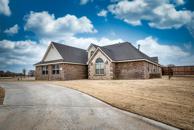 a view of a livingroom with furniture and windows