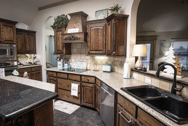 a living room with fireplace furniture and a flat screen tv