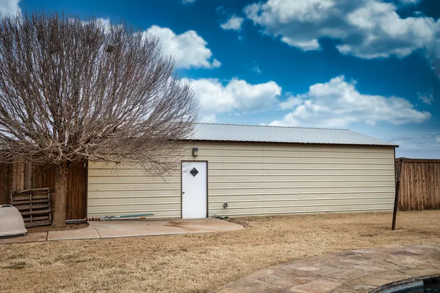 a view of a backyard of the house