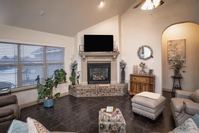a view of a dining room with furniture and chandelier