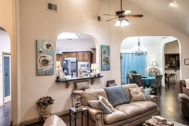 a kitchen with stainless steel appliances granite countertop a refrigerator and stove